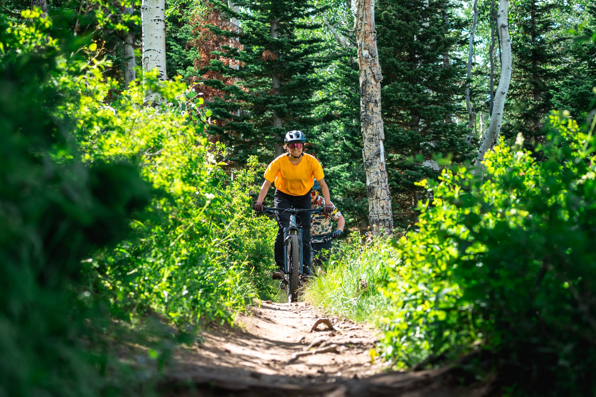 Mountain biker riding on a Skis on the Run mountain bike rental delivered to Deer Valley