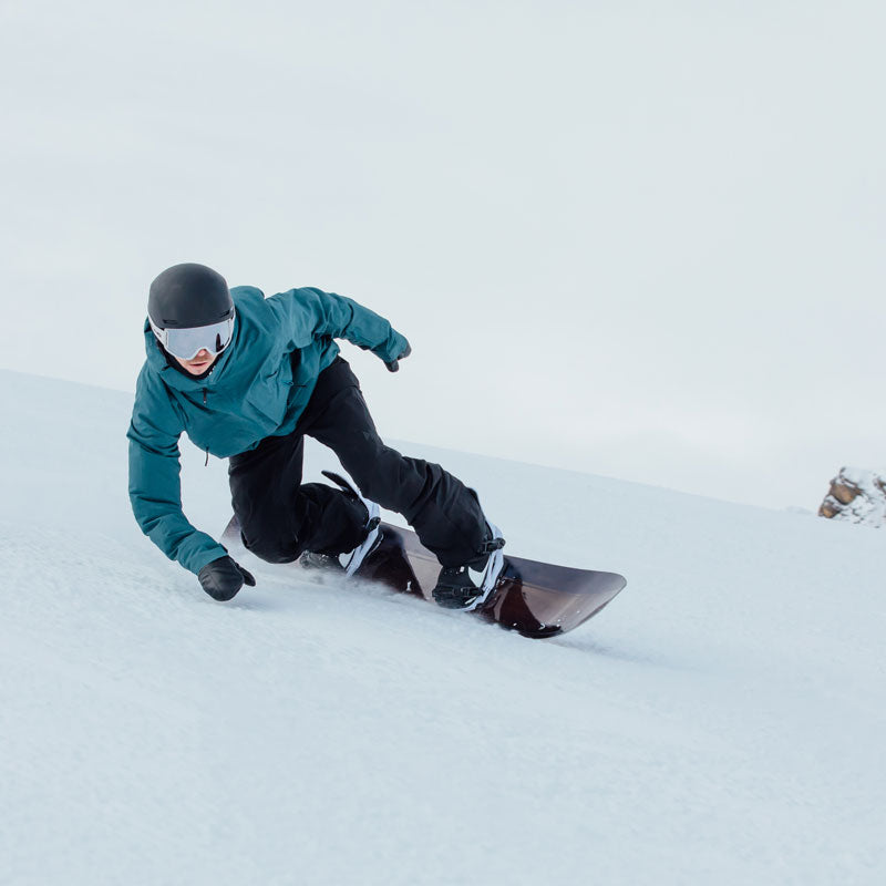 Snowboarder riding on a Skis on the Run snowboard rental in Park City Mountain Resort