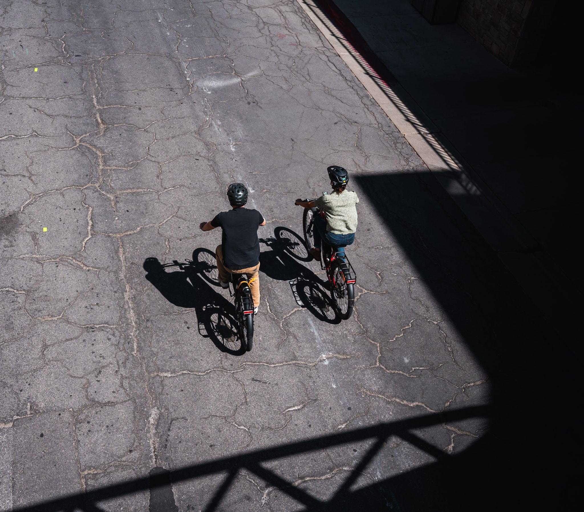 Two bikers riding on Main Street in Park City, Utah