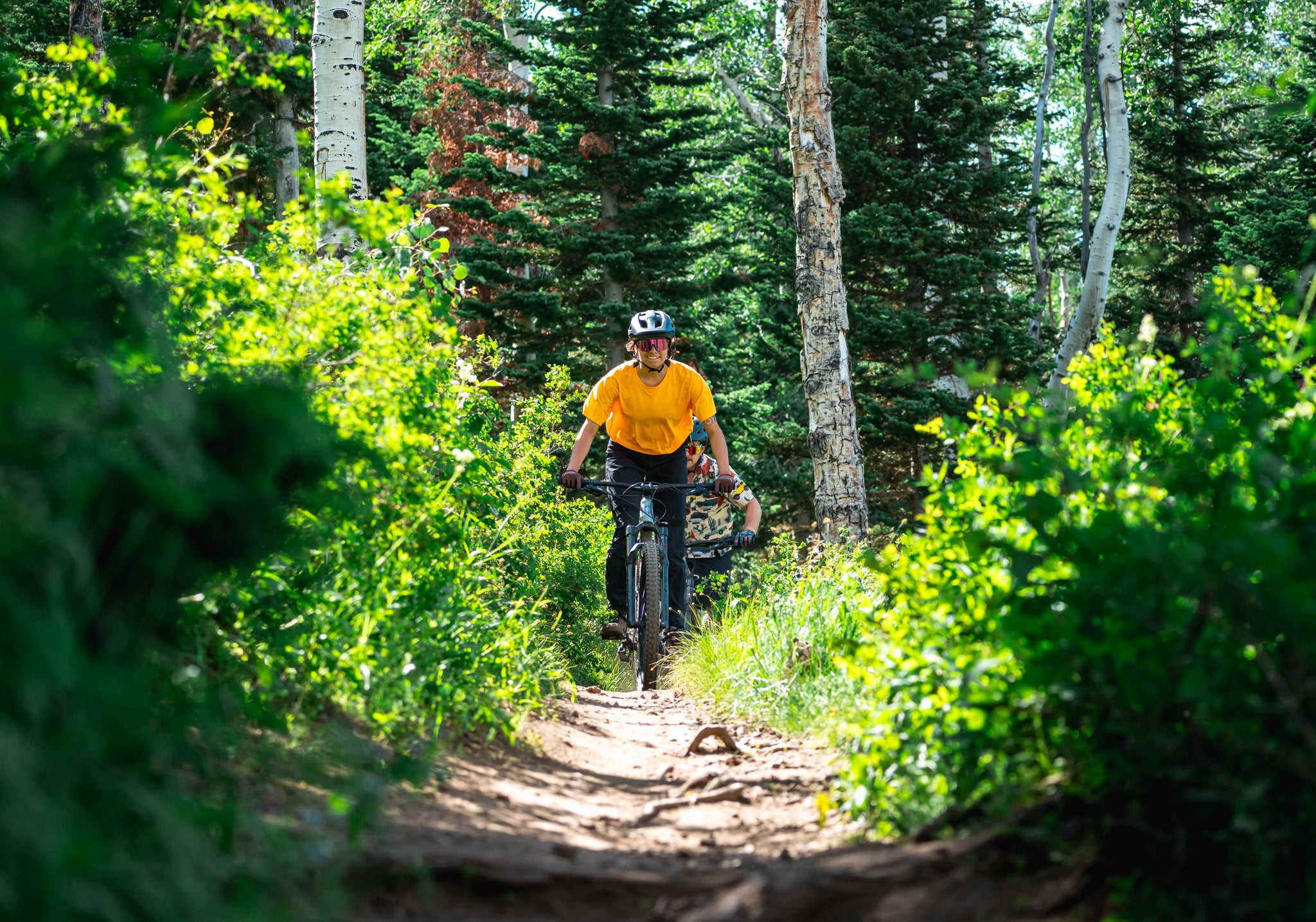 Mountain biker riding on a Skis on the Run mountain bike rental delivered to Deer Valley